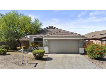 Charming single-Gathering home with a two-car garage and desert landscaping at 8753 E Plata Ave, Mesa, AZ 85212