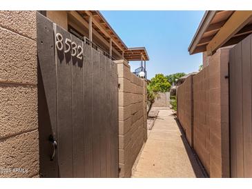 View of property entrance featuring a gated courtyard and walkway at 8532 E Portland St, Scottsdale, AZ 85257