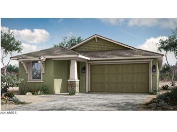 Charming single-story home with a two-car garage and desert landscaping at 14903 N 55Th Dr, Glendale, AZ 85306