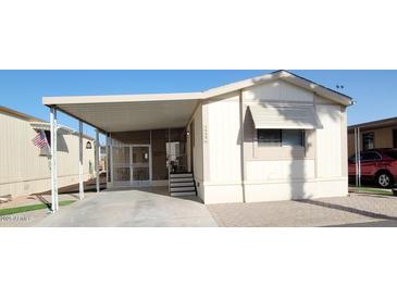 Inviting mobile home with covered parking and charming front porch at 17200 W Bell Rd # 1622, Surprise, AZ 85374