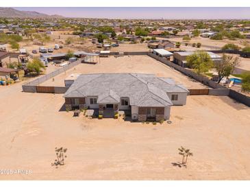 Expansive single-story home featuring a large lot and charming desert landscaping at 22414 W Meade Ln, Buckeye, AZ 85326