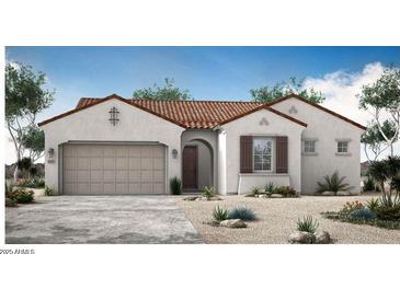 Charming single-story home featuring a tile roof, stucco walls, and a two-car garage at 5705 W St Moritz Ln, Glendale, AZ 85306