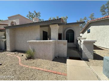 Charming single-story home with desert landscaping and an inviting entrance in a peaceful neighborhood at 1718 S Longmore St # 53, Mesa, AZ 85202