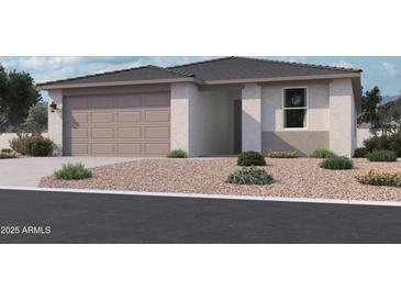 Charming single-story home with a two-car garage and well-maintained landscaping at 15789 W Beryl Ave, Waddell, AZ 85355