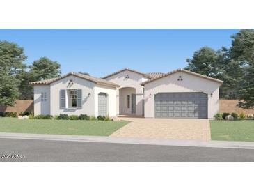 A charming single-story home displays a well-manicured lawn and stylish exterior at 25169 N 177Th Dr, Surprise, AZ 85387