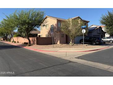 Two story home featuring a light brown stucco exterior, terracotta roof, and two car garage at 9904 E Elena Ave, Mesa, AZ 85208
