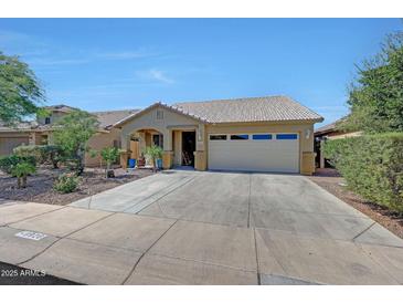 Charming single-story home with a well-maintained front yard and spacious driveway at 9926 W Gross Ave, Tolleson, AZ 85353