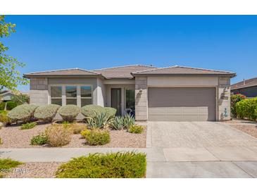 Charming single-story home featuring a well-maintained landscape and a neutral color scheme at 10240 E Supernova Dr, Mesa, AZ 85212
