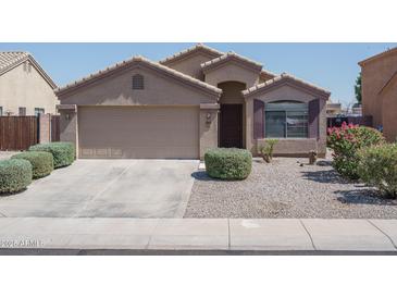 Charming single-story home with a well-manicured lawn and inviting curb appeal at 10618 W Pima St, Tolleson, AZ 85353