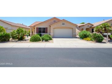 Charming single-story home featuring desert landscaping and a two-car garage at 17449 N Fairway Dr, Surprise, AZ 85374