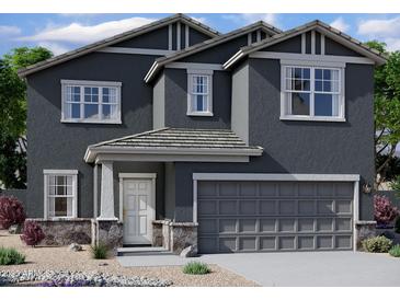 Charming two-story home with a gray exterior, covered entry, and a two-car garage at 1932 E Night Rider Rd, San Tan Valley, AZ 85140