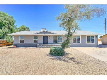 Charming single-story home featuring a xeriscaped front yard and a well-maintained exterior at 1716 W Villa Theresa Dr, Phoenix, AZ 85023