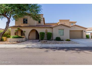 Stunning two-story home featuring a terracotta tile roof, arched entryway and a two car garage at 16178 W Granada Rd, Goodyear, AZ 85395