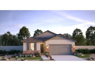 Charming single-story home with stone accents, neutral colors, and a well-manicured front yard at 17082 W Seldon Ln, Waddell, AZ 85355