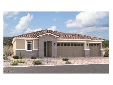 Stunning single-story home with a three-car garage and beautiful landscaping for great curb appeal at 12390 W Marguerite Ave, Avondale, AZ 85323