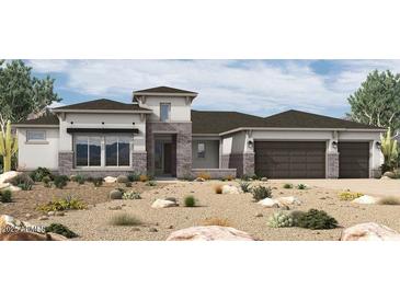 Inviting single-story home boasting a three-car garage and charming desert landscaping at 18138 E Creosote Ln, Queen Creek, AZ 85142