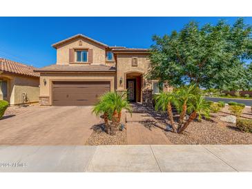 Charming two-story home with a well-manicured front yard and attached two car garage at 5235 S Dante --, Mesa, AZ 85212