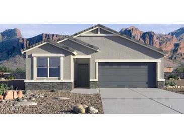 Beautiful single-story home with mountain views, low-maintenance landscaping, and neutral color scheme at 8516 W Clemente Way, Florence, AZ 85132