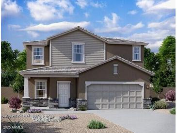 Charming two-story home with stone accents and a two-car garage at 15506 W Deanne Dr, Waddell, AZ 85355