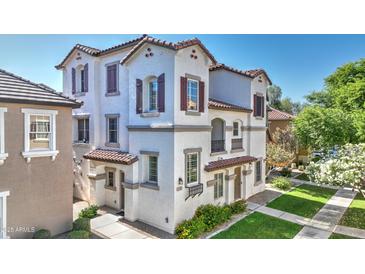 Charming, modern two-story home featuring a stucco facade, tiled roof, and well-maintained landscaping at 4169 E Jasper Dr, Gilbert, AZ 85296