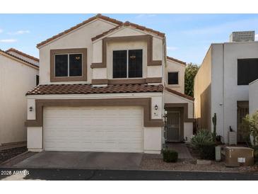 Charming two-story home featuring a red tile roof and a two-car garage at 2339 E Evans Dr, Phoenix, AZ 85022