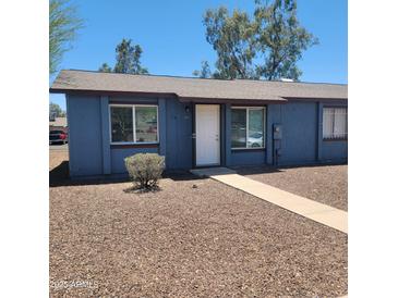 Single story home with desert landscaping and front door with security at 3645 N 69Th Ave # 99, Phoenix, AZ 85033