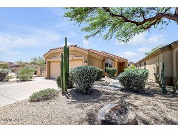 Charming home with desert landscaping, a two-car garage, and a welcoming entrance at 4327 E Desert Sky Ct, Cave Creek, AZ 85331