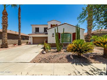 Charming two-story home boasts desert landscaping, red shutters, and a welcoming front entrance at 861 E Indian Wells Pl, Chandler, AZ 85249