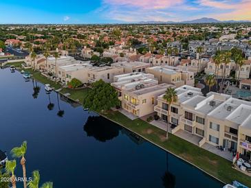 Stunning aerial view of waterfront condos showcasing beautiful architecture and water access at 1414 W Coral Reef Dr, Gilbert, AZ 85233
