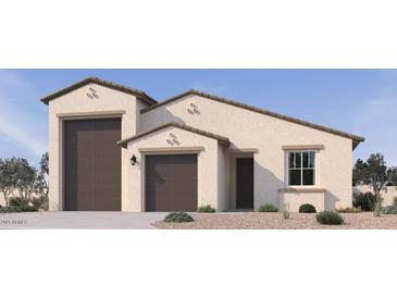Beautiful single-Gathering home featuring a two-car garage, neutral stucco, and a covered front entryway at 15727 W Brown St, Waddell, AZ 85355