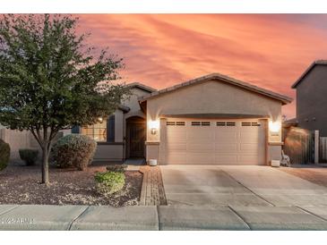 Charming single-Gathering home featuring a two-car garage, desert landscaping and neutral-toned exterior paint at 1783 W Cool Water Way, San Tan Valley, AZ 85144