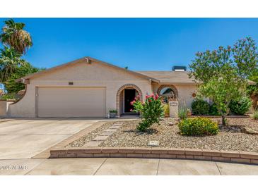 Charming single-story home features a landscaped front yard and inviting arched entryway at 2312 W Temple St, Chandler, AZ 85224