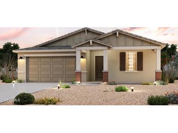 Charming single-Gathering home with a two-car garage, neutral color palette, and desert landscaping at 39970 W Sparks Ln, Maricopa, AZ 85138
