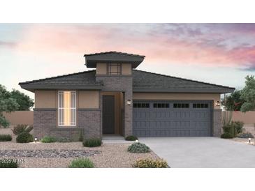 Charming single-story home with a stone facade, gray roof, and desert landscaping for a modern look at 31982 N 117Th Ave, Peoria, AZ 85383