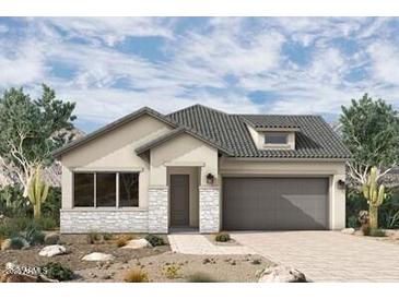 Charming single-story home featuring a neutral color palette, a two-car garage, and desert landscaping for a low-maintenance appeal at 36049 N Barrel Aged Dr, San Tan Valley, AZ 85140