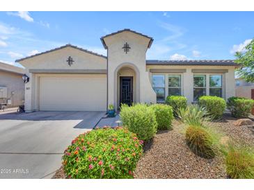 Beautiful front exterior showcases a charming home with a well-manicured, landscaped yard at 5637 S Parrish --, Mesa, AZ 85212