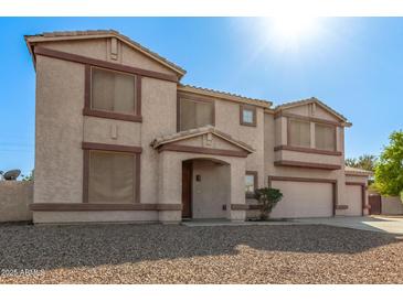 Inviting two-story home featuring neutral stucco and a two-car garage at 31700 N Sunflower Way, San Tan Valley, AZ 85143