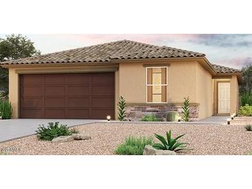 Charming single-story home with a tile roof, desert landscaping and an attached two-car garage at 7956 S Namaka Dr, Casa Grande, AZ 85193