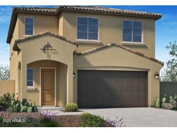 Charming two-story home showcasing a desert-landscaped front yard and a spacious two-car garage at 13244 N 146Th Ln, Surprise, AZ 85379