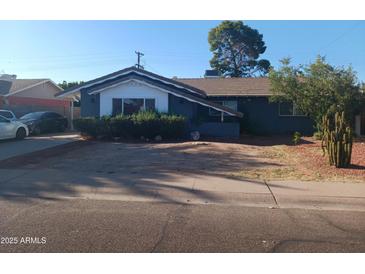 Cozy single-story home featuring desert landscaping and a classic-style roof at 3830 W Cavalier Dr, Phoenix, AZ 85019