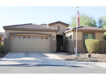 Charming single-Gathering home featuring a two-car garage, tile roof, and well-maintained landscaping at 4778 E Sourwood Dr, Gilbert, AZ 85298