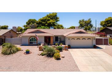 Charming single-story home with desert landscaping, a two-car garage, and a welcoming front entrance at 7318 S Mcallister Ave, Tempe, AZ 85283