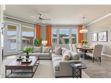 Bright, open living room with modern furniture and large windows, creating an inviting and spacious atmosphere at 7601 E Indian Bend Rd # 3002, Scottsdale, AZ 85250