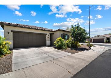 Charming single-story home featuring a two-car garage, desert landscaping, and a welcoming facade at 2753 E Fossil Ridge Rd, Phoenix, AZ 85050