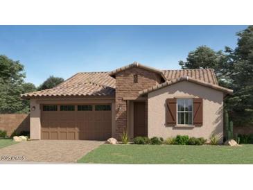 Charming single-story home featuring a tile roof, stucco siding, and a two-car garage at 1378 W J Waltz Way, Apache Junction, AZ 85120