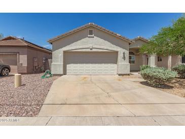 Charming single-story home with a neutral color palette, desert landscaping, and a two-car garage at 15034 N 30Th St, Phoenix, AZ 85032