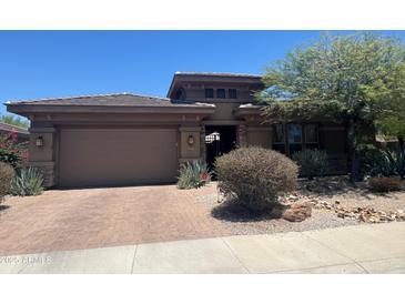 Charming single-Gathering home with a two-car garage, brick driveway, and drought-tolerant landscaping at 18008 W Ocotillo Ave, Goodyear, AZ 85338