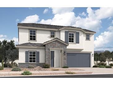 Inviting two-story home featuring gray accents, a covered porch, and an attached two-car garage at 18824 N Barano Dr, Maricopa, AZ 85138