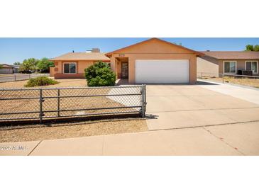 Charming single-story home featuring a two-car garage and easy to maintain desert landscaping at 3507 W Oakland St, Chandler, AZ 85226
