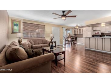 Inviting living room featuring hardwood floors and comfortable seating arrangement at 1133 N 84Th Pl, Scottsdale, AZ 85257
